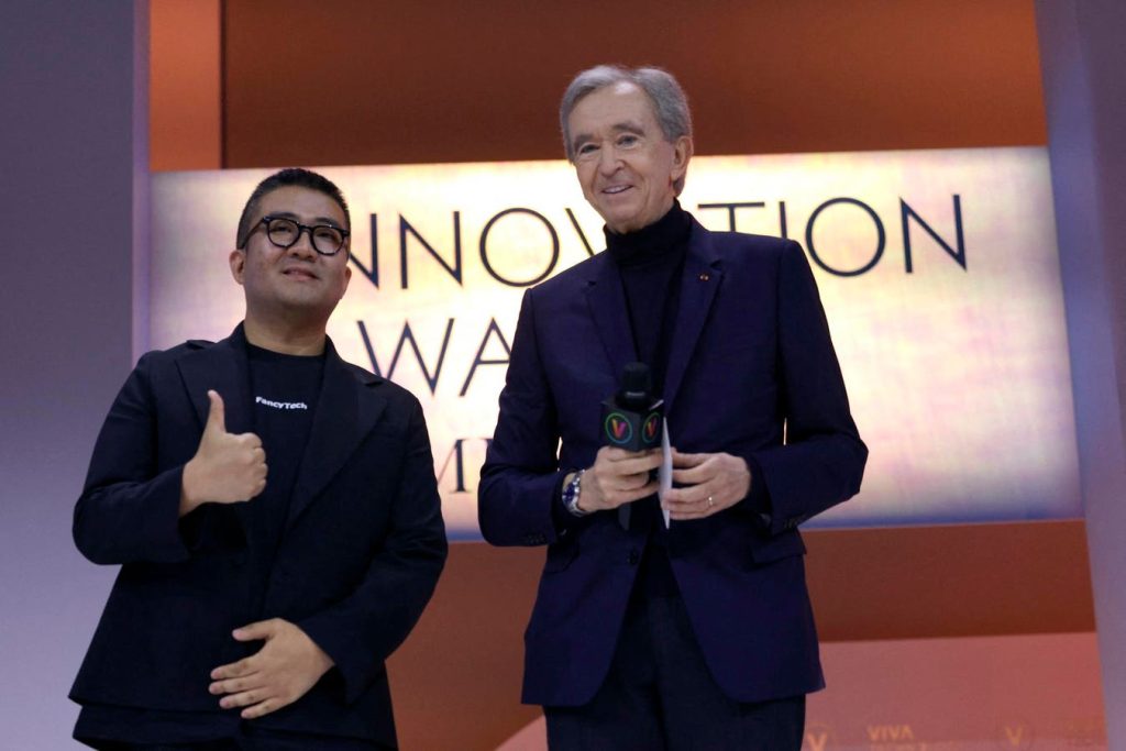 LVMH CEO Bernard Arnault and FancyTech’s Morgan Mao recently celebrated the LVMH Innovation Awards at VivaTech 2024. This event showcased the increasing influence of generative AI (GenAI) in luxury brands.